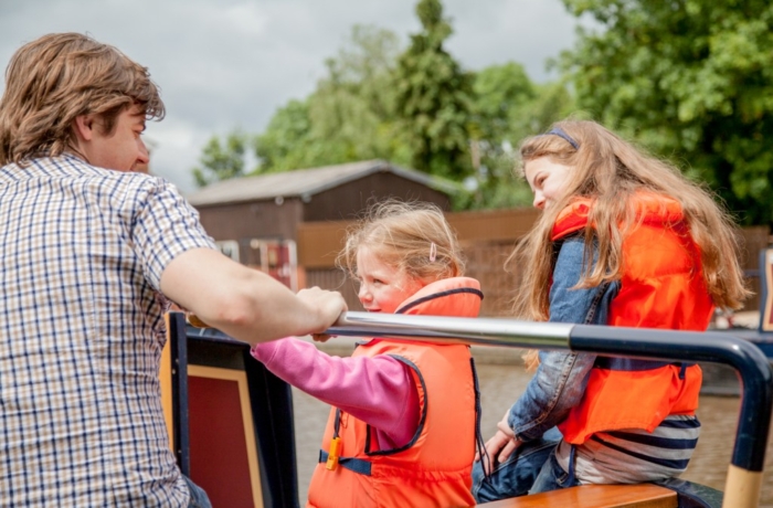 Black Prince Holidays - Young children getting involved in driving a boat